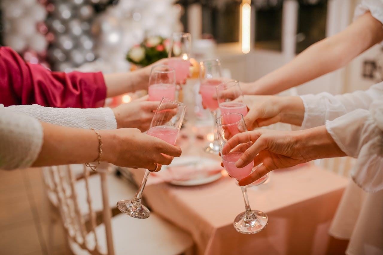 ladies raising a glass of pink champagne at a baby shower - special celebration venue Cardigan bay
